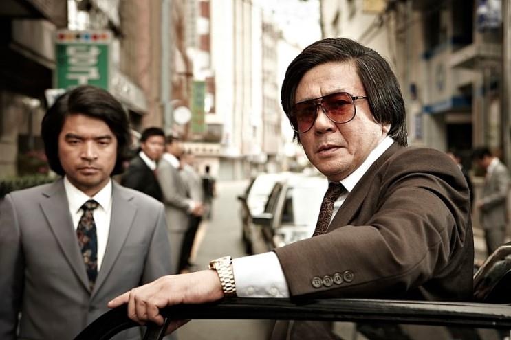 A Protagonist Who Gradually Enters a Dark Path from Life as a Civil Servant (Source: A Publicity Still from the Film Nameless Gangster: Rules of the Time)